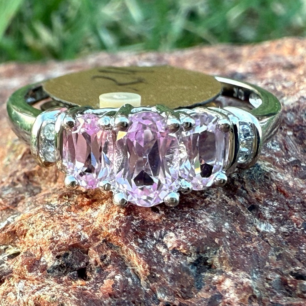 Triple Pink Sapphire and diamond ring set in elegant 10 karat gold